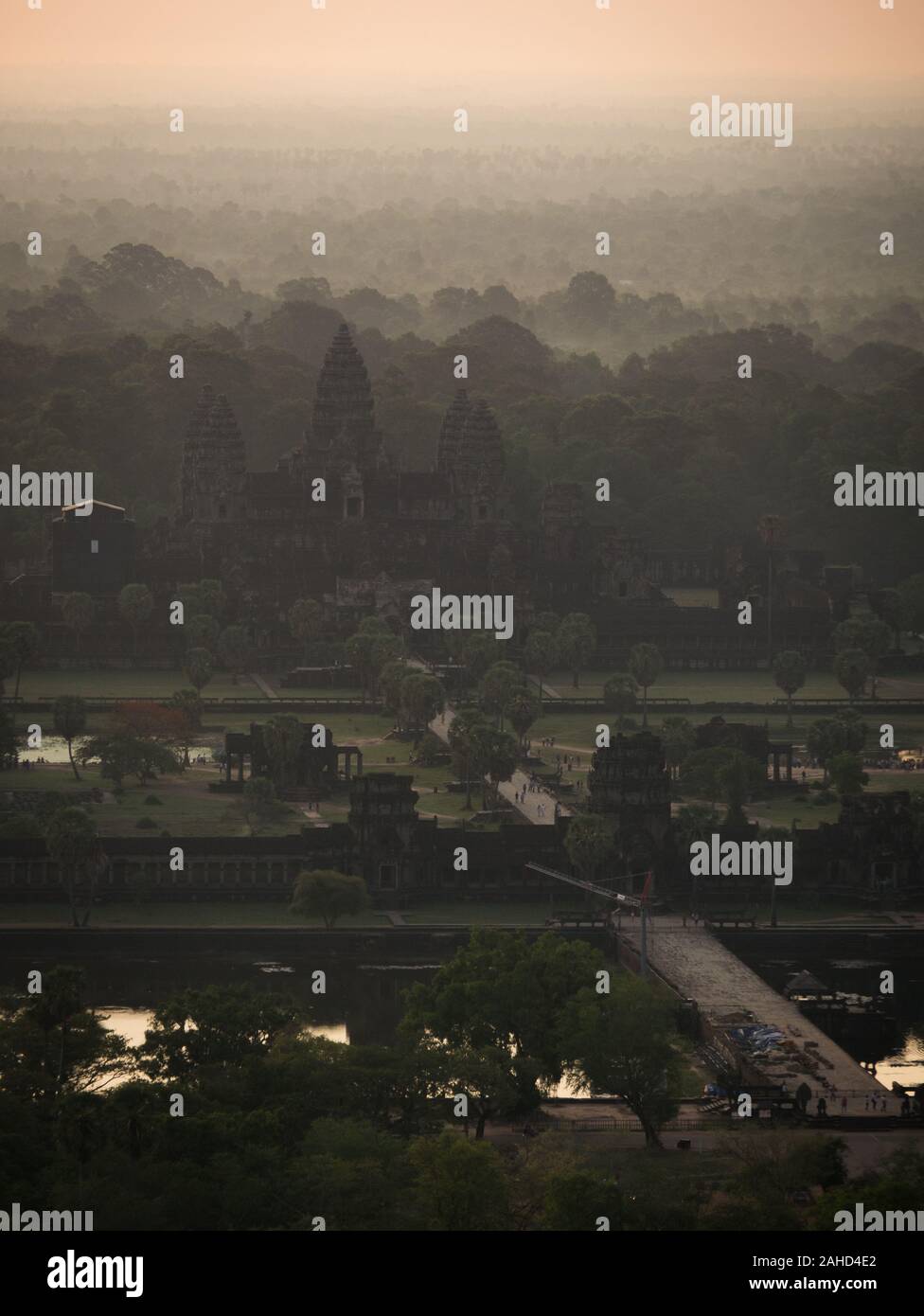 Aerial view on Angkor Wat temple complex and ancient city of Angkor at sunrise on a misty morning, Siem Reap, Cambodia Stock Photo