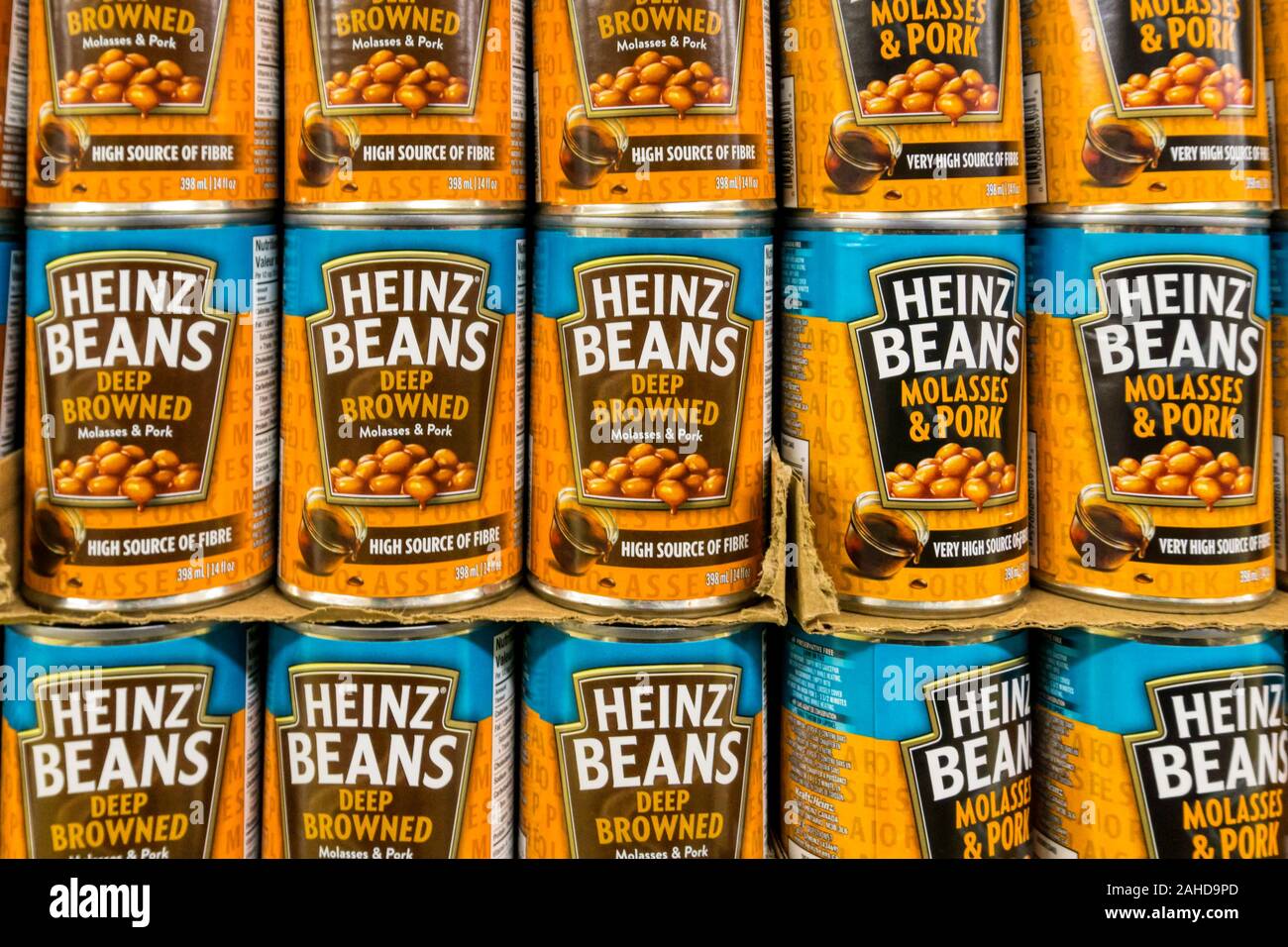 Tins of different varieties of Heinz Baked Beans for sale on the shelves of a Canadian supermarket. Stock Photo