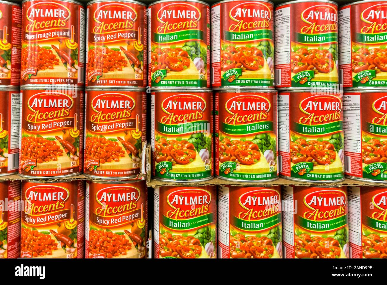 Aylmer Accents tinned tomatoes for sale on the shelves of a Canadian supermarket. Stock Photo