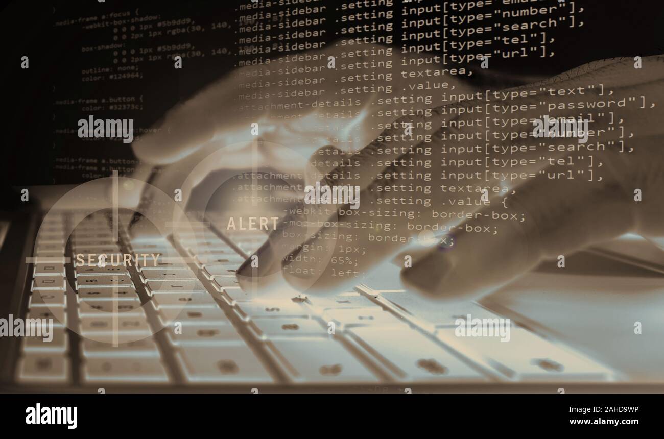 Concept of information security system - a hacker or programmer codes a program or firewall on a computer at night (composite image) Stock Photo