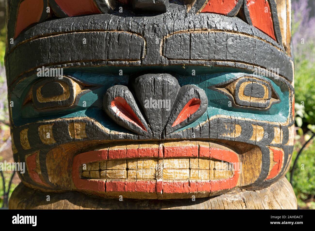 Detail of the Kwakiutl Totem at Confederation Park in Ottawa, Canada. The totem was carved by Henry Hunt in 1971 to commemorate the centenary of Briti Stock Photo