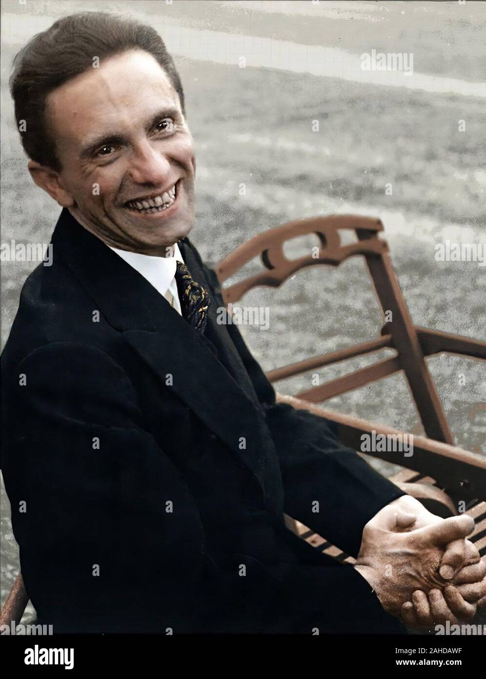 German Minister of Culture Joseph Goebbels sitting outside in garden of Carlton Hotel during occasion of League of Nations meeting Stock Photo