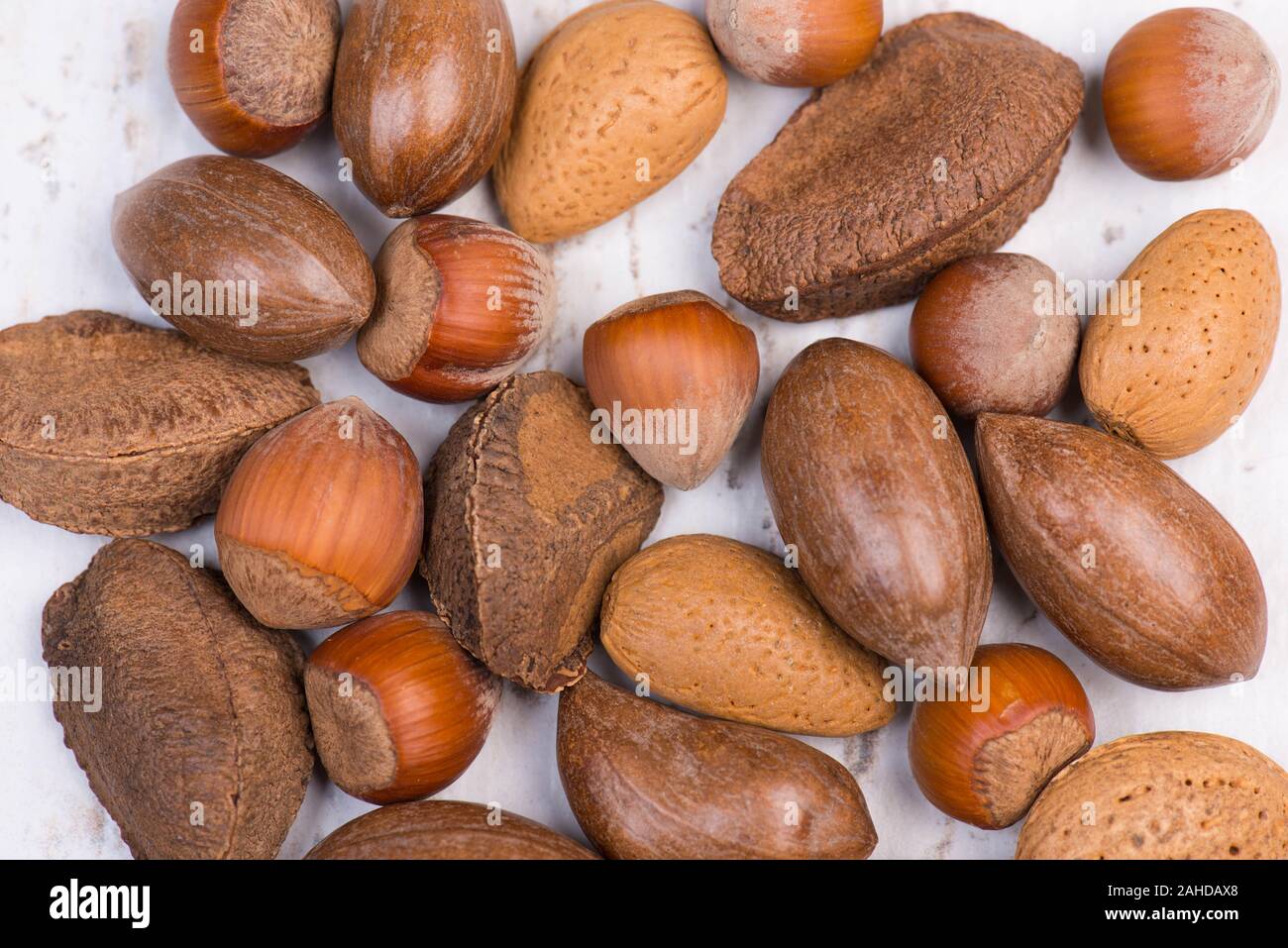 Mixed nuts, hazelnuts, walnuts, brazil nuts, pecan nuts, almonds Stock Photo