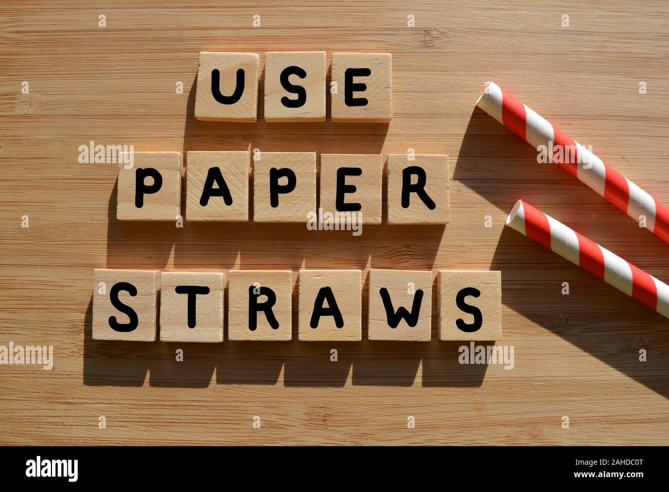 Use Paper Straws, words in 3d wooden alphabet letters on a wood