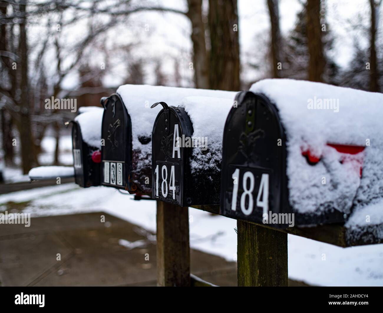 Snow Covers Some Mailboxes In the Winter Stock Photo