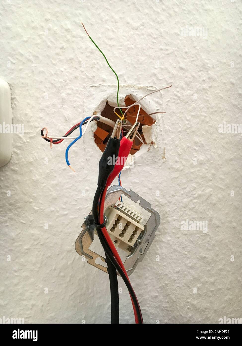 Colorful cables of a telephone connection socket in Germany are tested of a  signal Stock Photo - Alamy