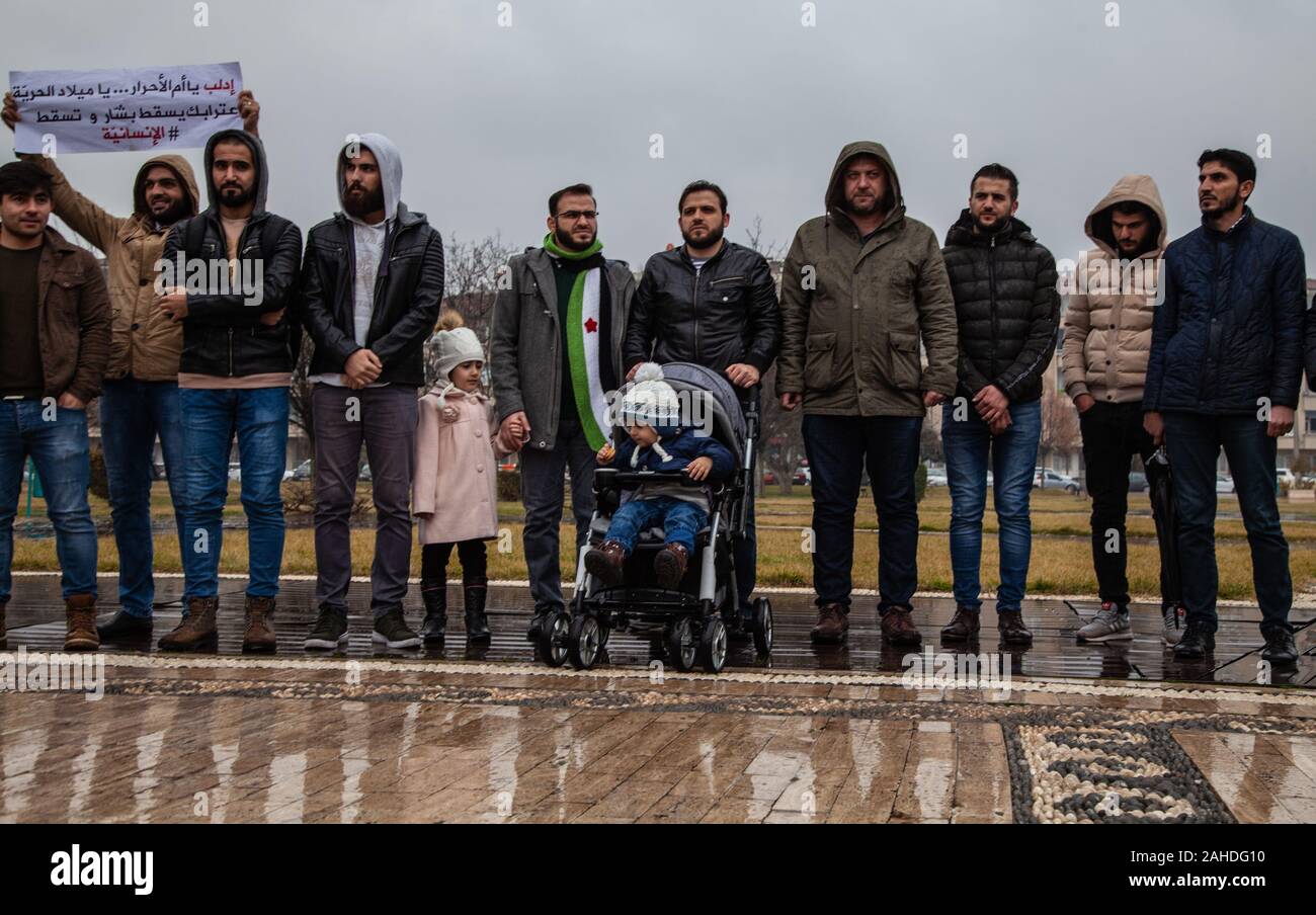 A group of Syrian youth take part during the demonstration.A group of Syrian refugees in Turkey, the city of Gaziantep protest in solidarity with the people in Syria and also hold signs calling for an end to the bombing of the city of Idlib by Russia and the Assad regime. Stock Photo