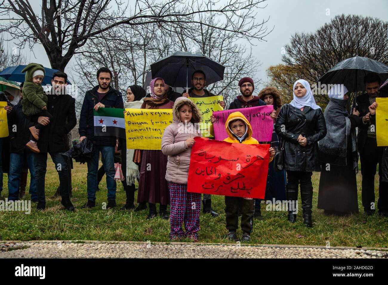 Kids hold a placard during the demonstration.A group of Syrian refugees in Turkey, the city of Gaziantep protest in solidarity with the people in Syria and also hold signs calling for an end to the bombing of the city of Idlib by Russia and the Assad regime. Stock Photo
