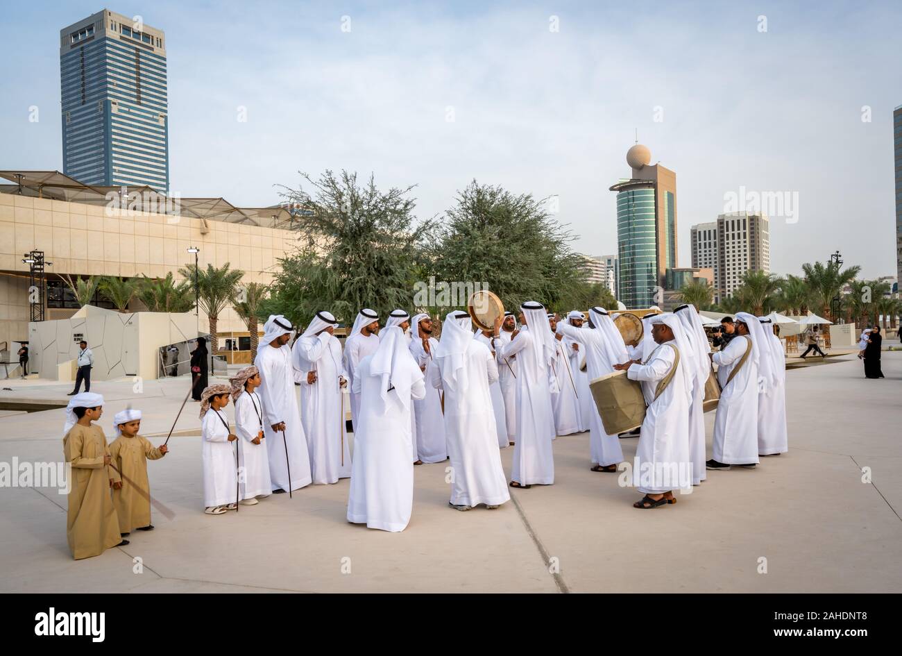 Arabic Men Standing In Traditional Cloth Around Modern Buildings ...