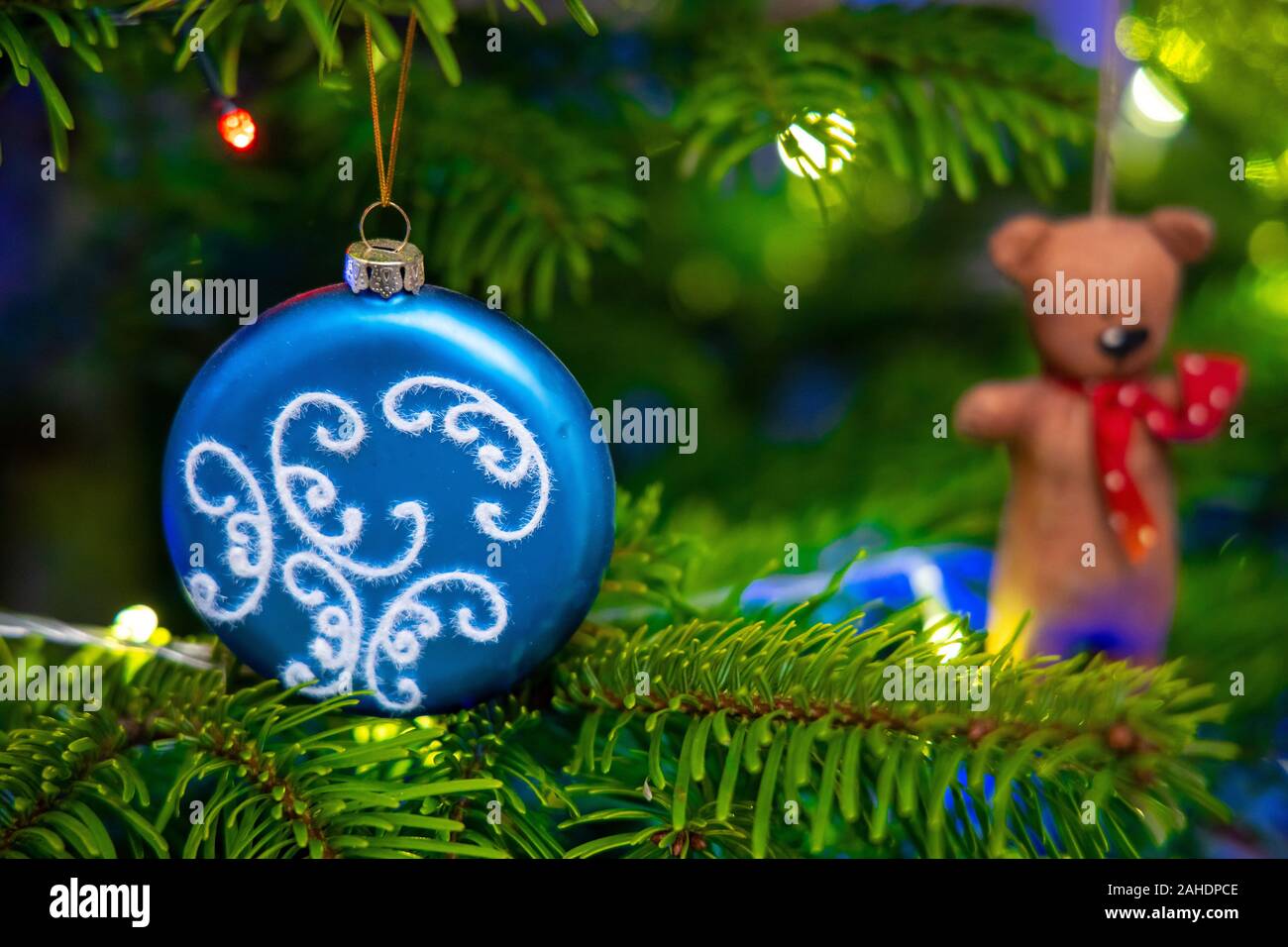 Vintage toys on a Christmas tree close-up, holiday traditions. Small depth of field Stock Photo