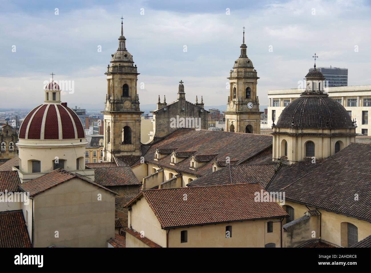 Rooftops, domes, and towers of historic buildings in La Candelaria, Bogota, Colombia, with La Catedral Primada and Capilla Sagrario in foreground Stock Photo