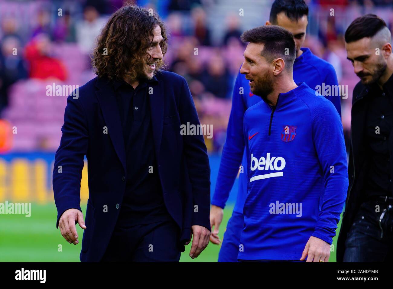BARCELONA - DEC 21: Carles Puyol (L) and Messi (R) prior to the La Liga match between FC Barcelona and Deportivo Alaves at the Camp Nou Stadium on Dec Stock Photo