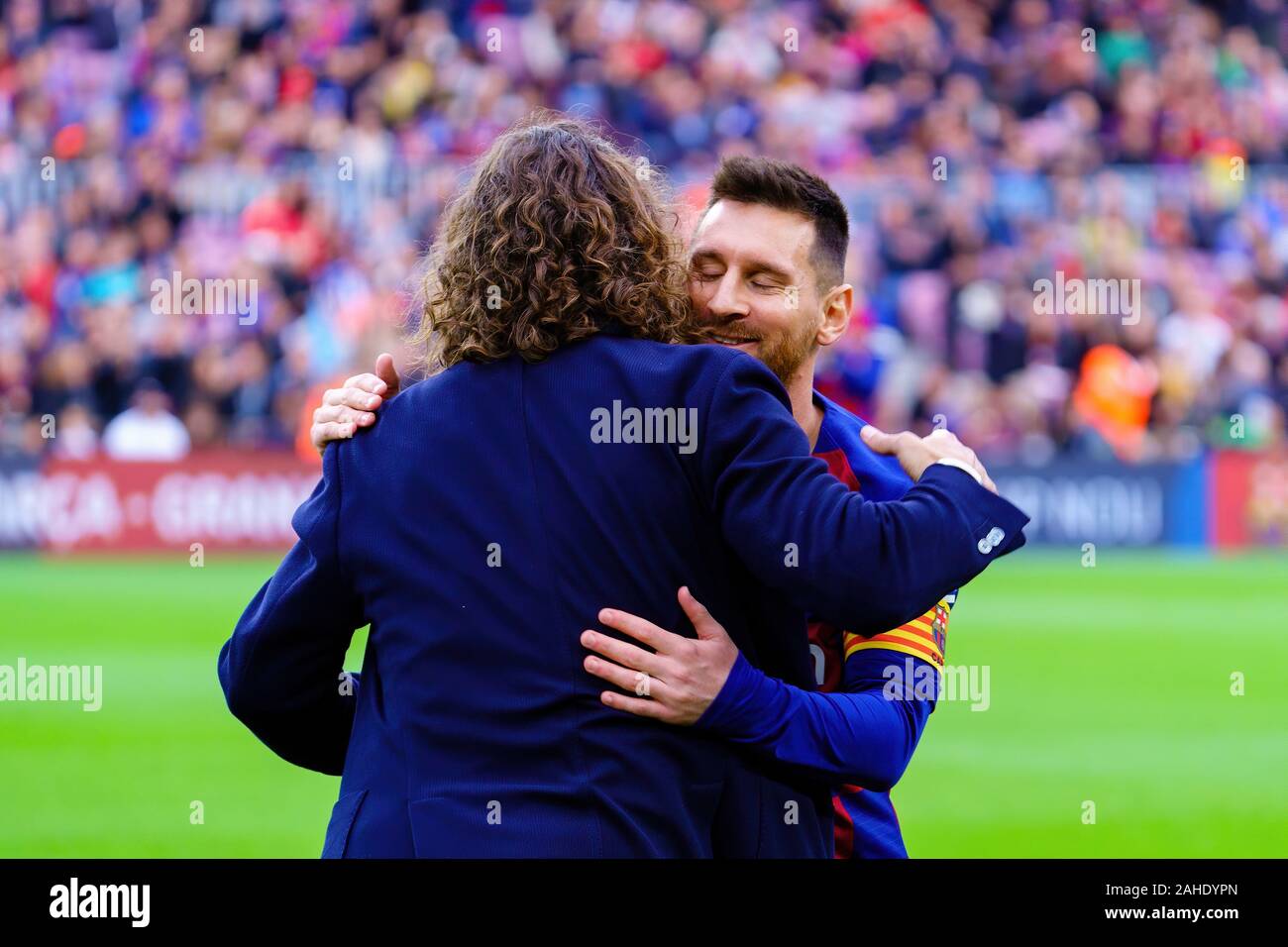 BARCELONA - DEC 21: Carles Puyol (L) and Messi (R) prior to the La Liga match between FC Barcelona and Deportivo Alaves at the Camp Nou Stadium on Dec Stock Photo