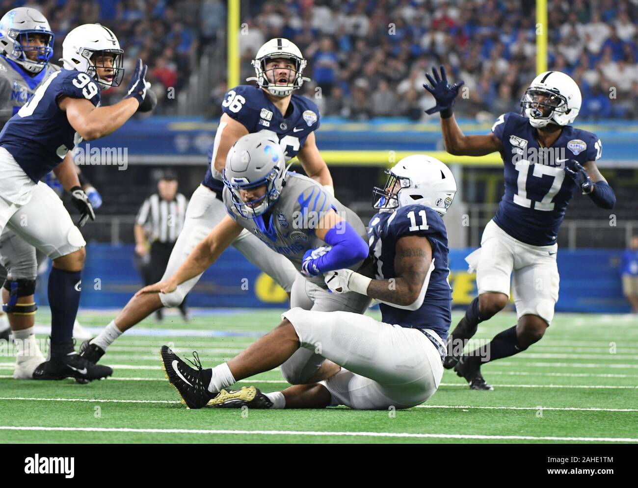 Arlington, United States. 28th Dec, 2019. Penn State's Micah Parsons sacks Memphis Tigers Brady White resulting in an interception by Garrett Taylor (17) in 84th Goodyear Cotton Bowl Classic on Saturday, December 28, 2019 at AT&T Stadium. The Nittany Lions defeated the Tigers 53-39. Photo by Ian Halperin/UPI Credit: UPI/Alamy Live News Stock Photo