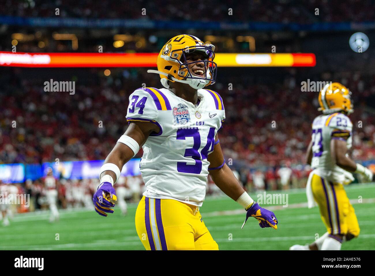 Atlanta, GA, USA. 28th Dec, 2019. LSU Tigers cornerback Lloyd Cole (34) gets excited after another kickoff against the Oklahoma Sooners in the 52nd Chick-fil-a Peach Bowl at Mercedes-Benz Stadium in Atlanta, GA. (Scott Kinser/Cal Sport Media). Credit: csm/Alamy Live News Stock Photo