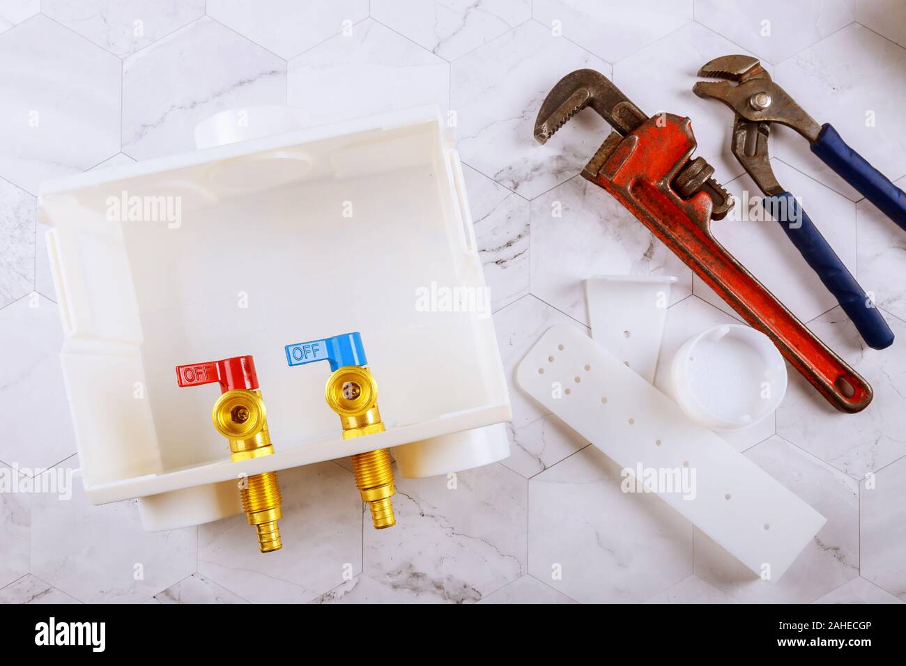 Washer dual drain outlet box and monkey wrench adjustable Stock Photo