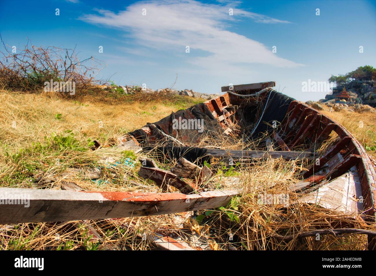 In this unique photo you can see an old broken wooden fishing boat that ...