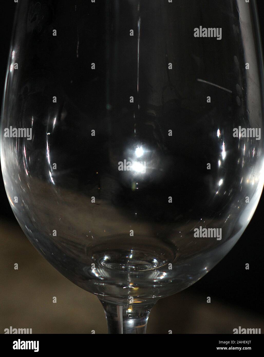 Moonlight reflected in an empty wine glass Stock Photo