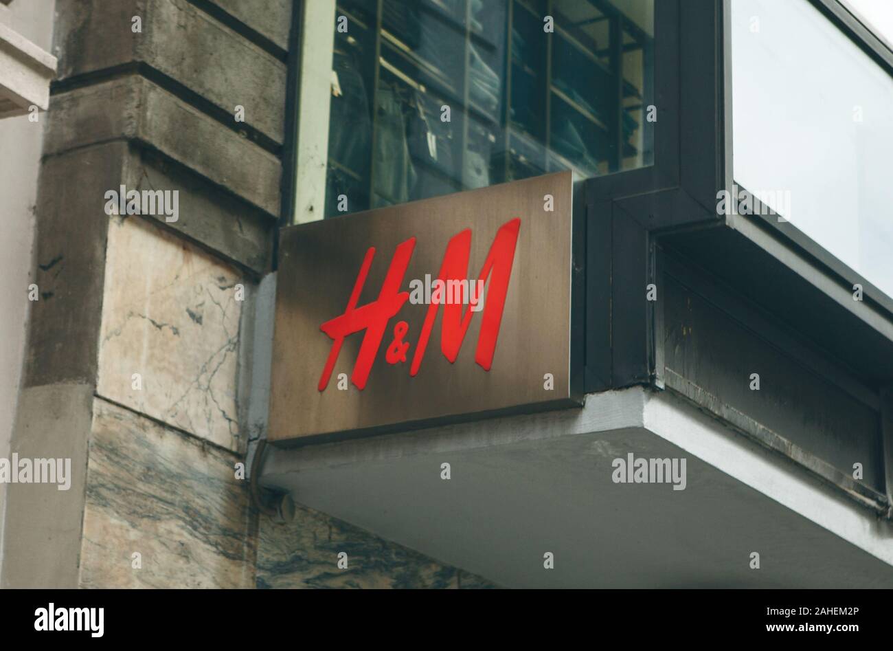Italy, Milan, May 30, 2019: HM company sign at the entrance to the store. Stock Photo