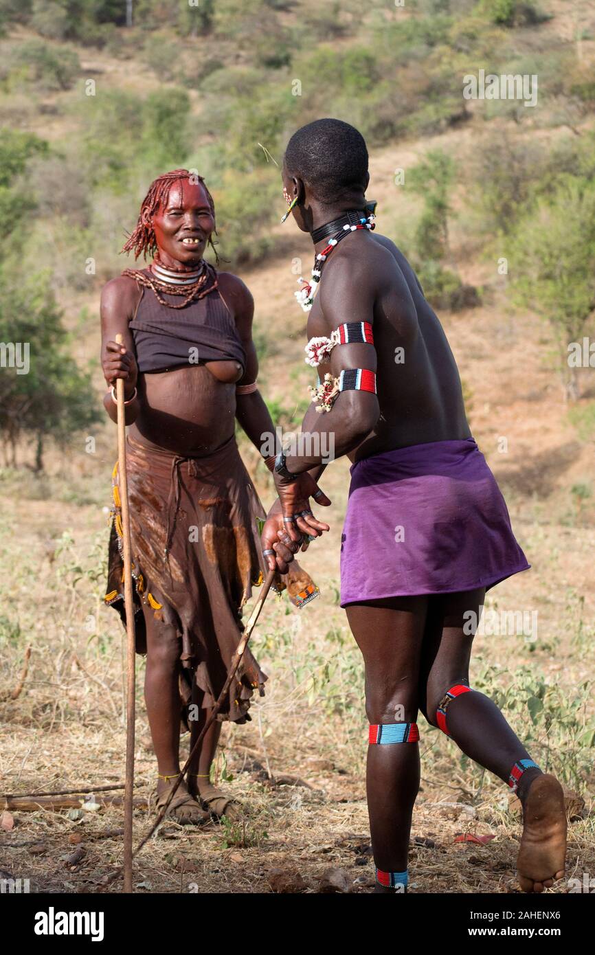 Woman whipped at Hamar tribe bull jumping ceremony.  Bull jump is the most important ceremony for young men, final test before passing into adulthood Stock Photo