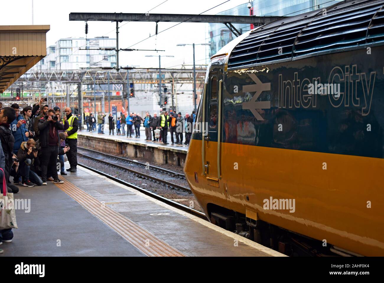Rail enthusiasts photograph a restored InterCity 125 train at King's Cross Station concluding a 4 day tour as the last HST on the East Coast Main Line Stock Photo