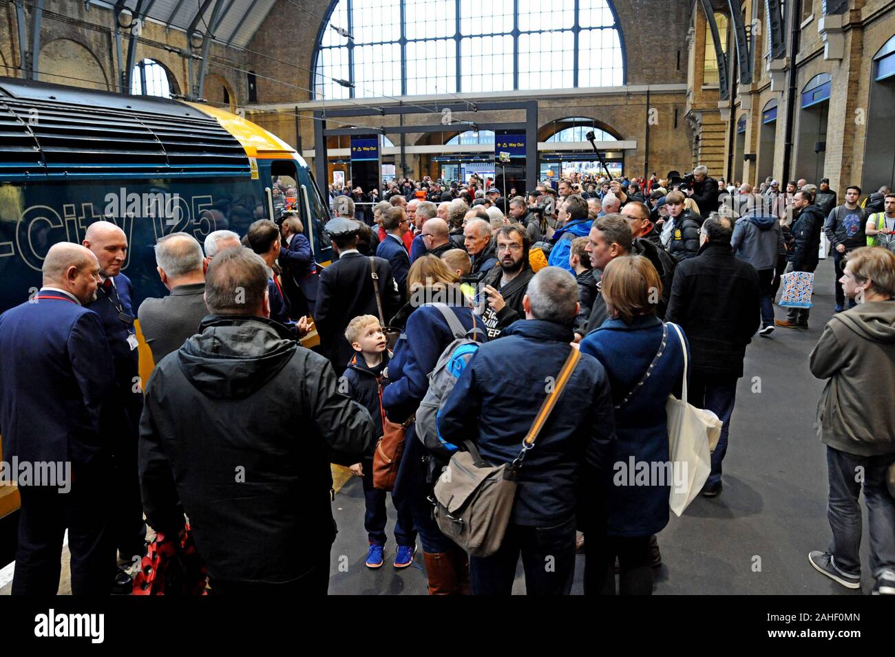 Rail enthusiasts photograph a restored InterCity 125 train at King's Cross Station concluding a 4 day tour as the last HST on the East Coast Main Line Stock Photo
