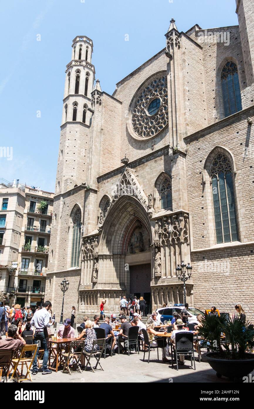 BARCELONA - JUNE 20, 2019: tourists hanging out and walking around Santa Maria del Mar church. Some tourists wander around Basilica of Santa Maria del Stock Photo
