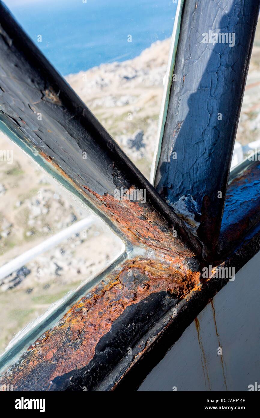 Rusting lantern window struts in the lantern room at Portland Bill lighthouse, Dorset, England, UK Stock Photo