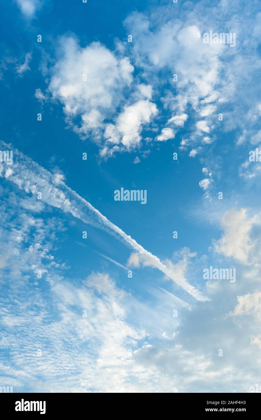 Stunning blue sky with white clouds. Vertical shot. Stock Photo