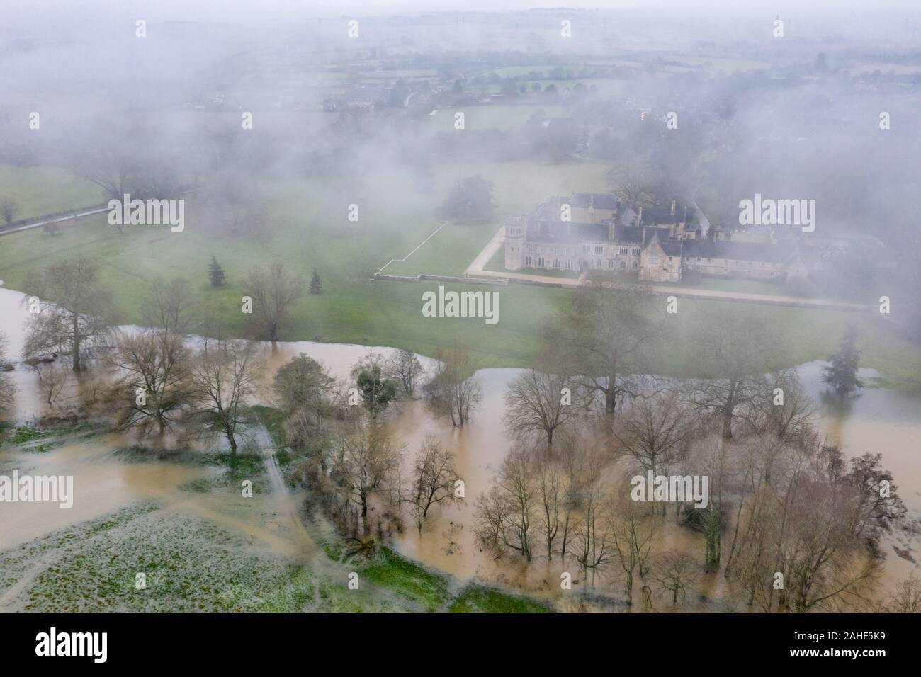 Lacock, Wiltshire, UK. 20th December 2019.  The Environment Agency has issued a red flood warning for Reybridge next to the historic village of Lacock Stock Photo