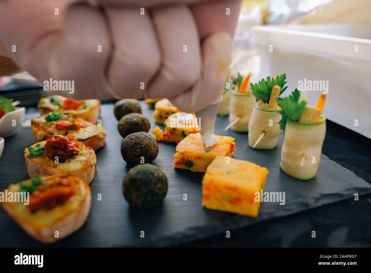 Canape close up. Preparing and serving canapes at the event. Served finger food close up. Event food. Stock Photo