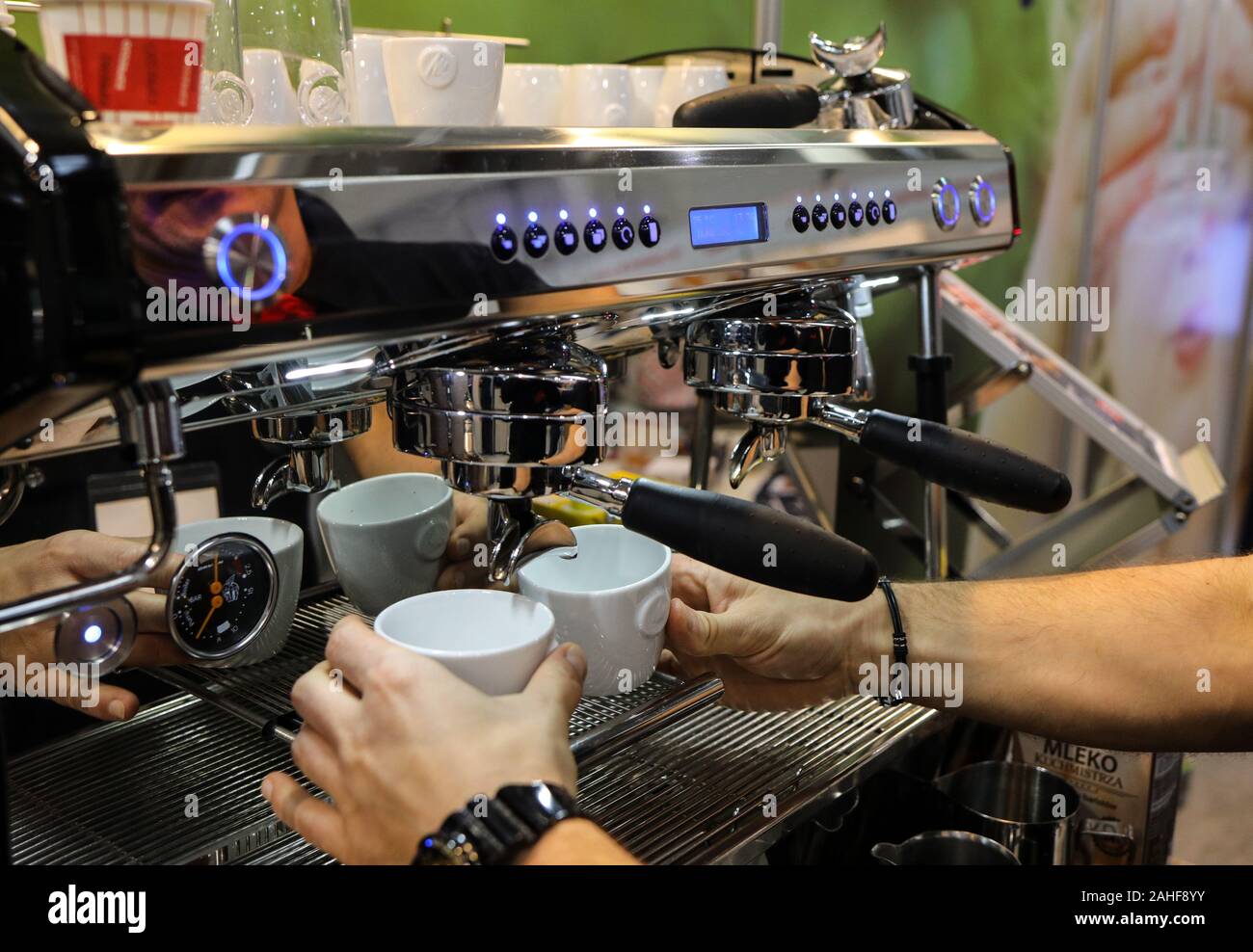 Cracow, Poland - November 20, 2019: Barista making coffee at coffee machine  at Gastrofood - Trade Fair for Food and Drinks for Catering in Cracow. Po  Stock Photo - Alamy