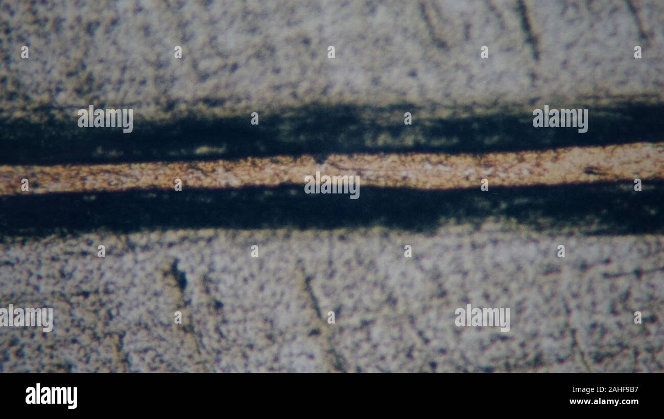 metallurgical micrograph of a copper brazed joint between two pieces of
