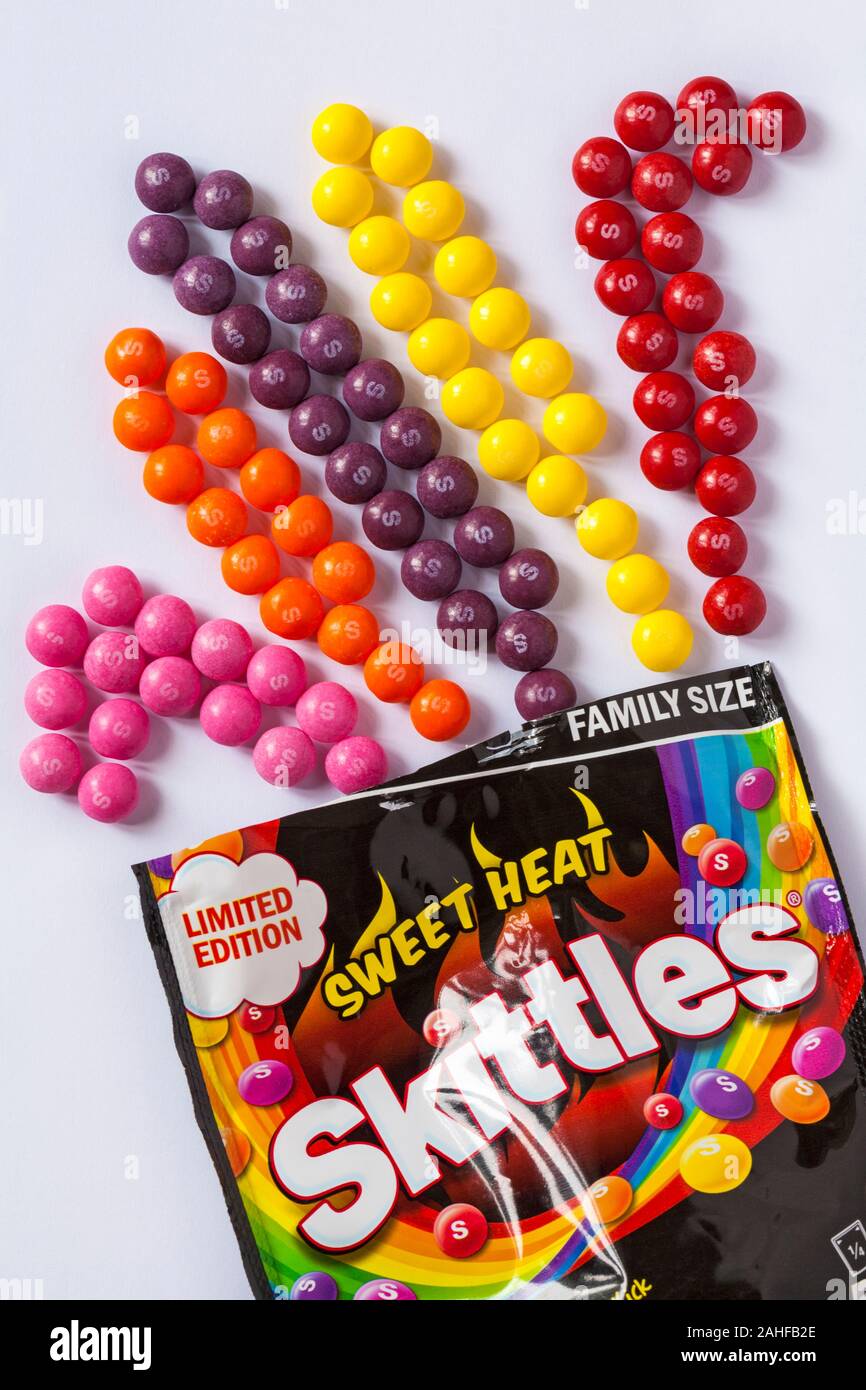 packet of Limited Edition Sweet Heat Skittles fruity flavours with a spicy kick opened with