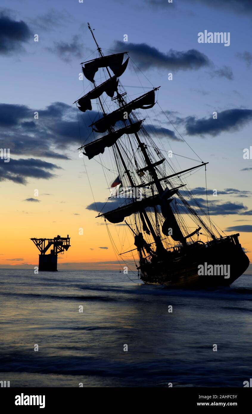 Beautiful Sunrise Next To A Vintage Brigantine Sailboat Stock Photo Alamy