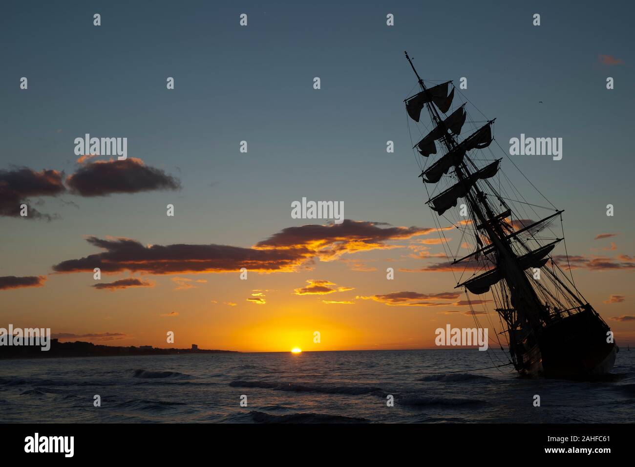 Beautiful Sunrise Next To A Vintage Brigantine Sailboat Stock Photo Alamy