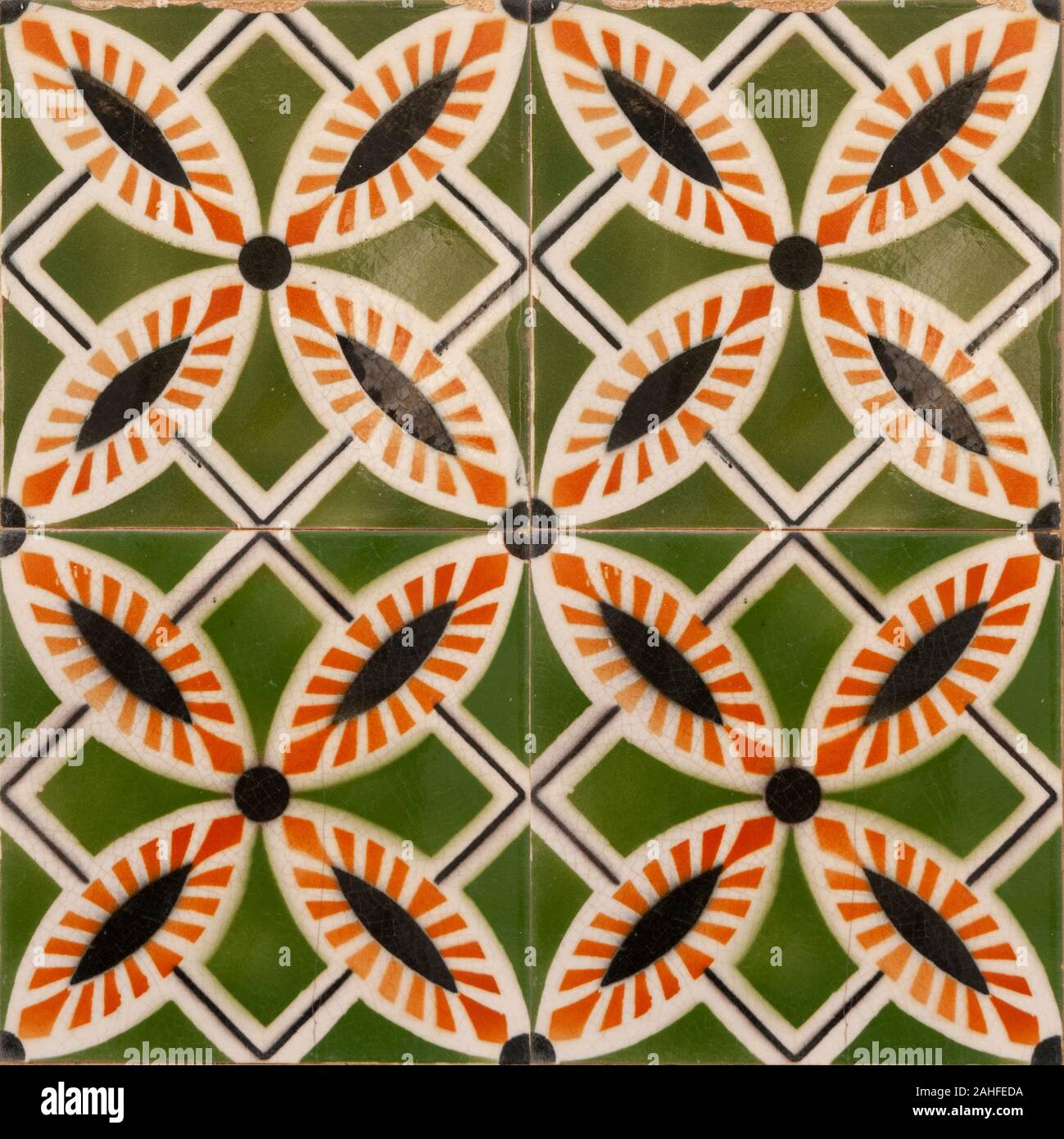 Traditional orange and green Portuguese seamless ceramic tiles used to