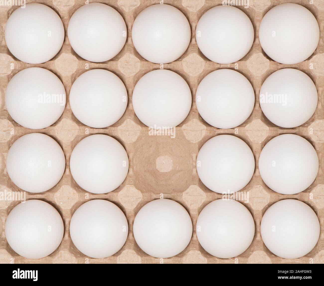 White chicken eggs in the carton box. Stock Photo