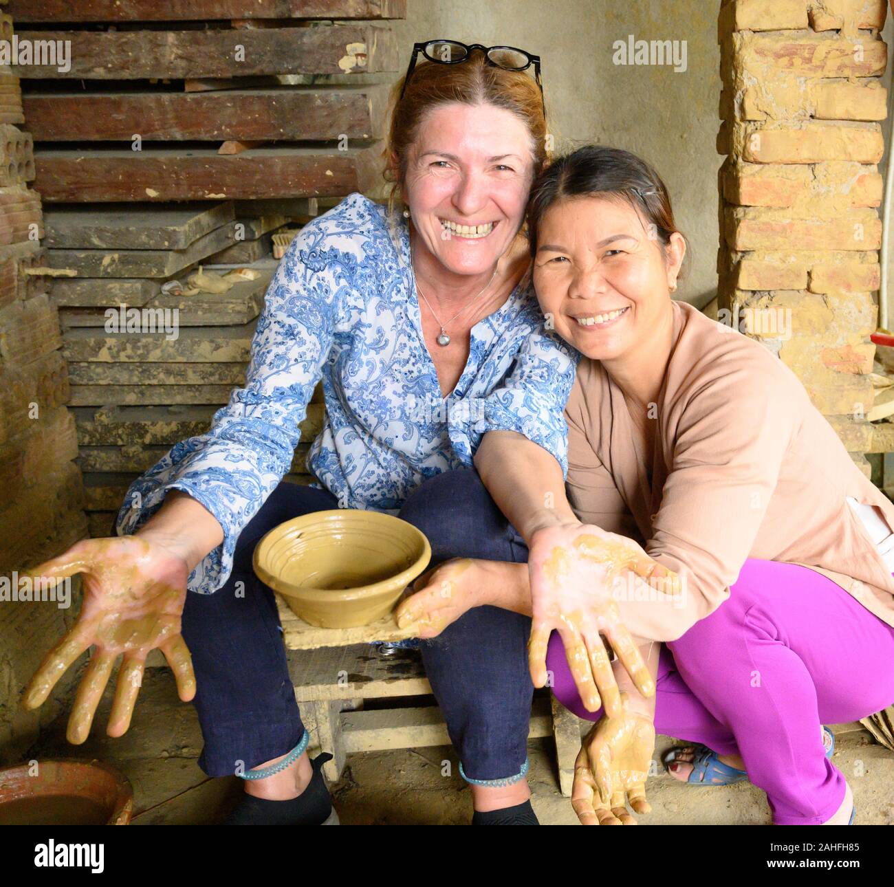 Making traditional pottery using a foot powered wheel Stock Photo Alamy