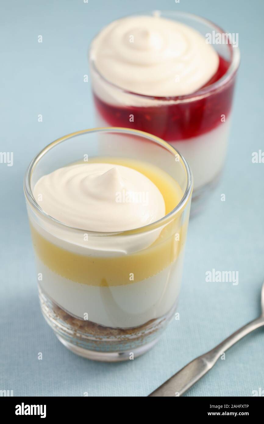 Raspberry and lemon trifle desserts closeup topped with custard Stock Photo