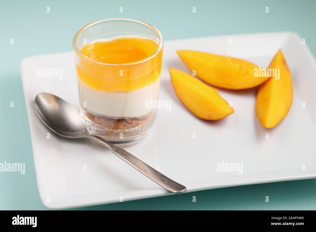 Mango and cream trifle dessert closeup with sliced mango fruit Stock Photo