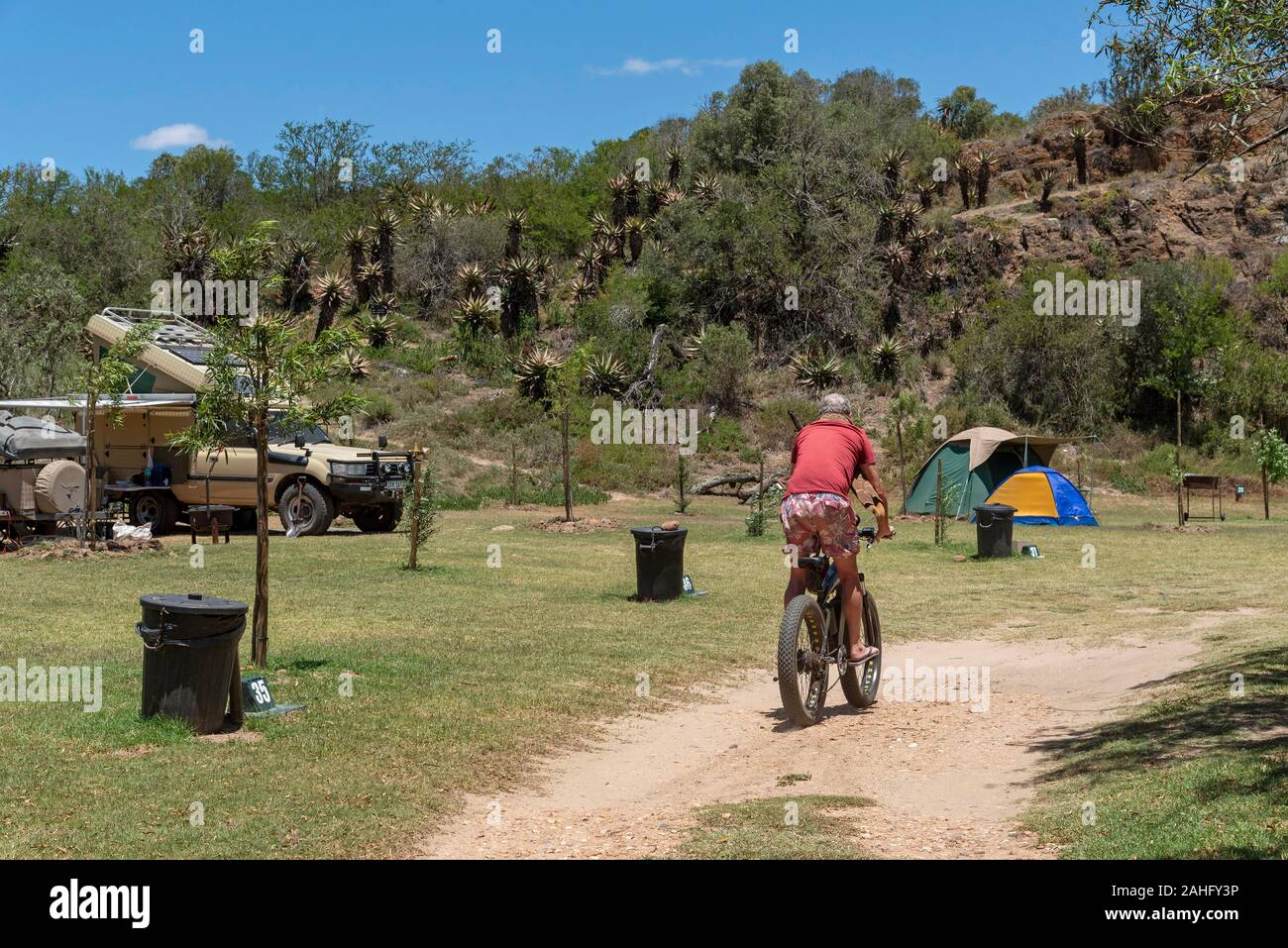 Swellendam, Western Cape, South Africa, December 2019. Couple with cycles on a campsite along the Garden Route at Swellendam, South Africa Stock Photo