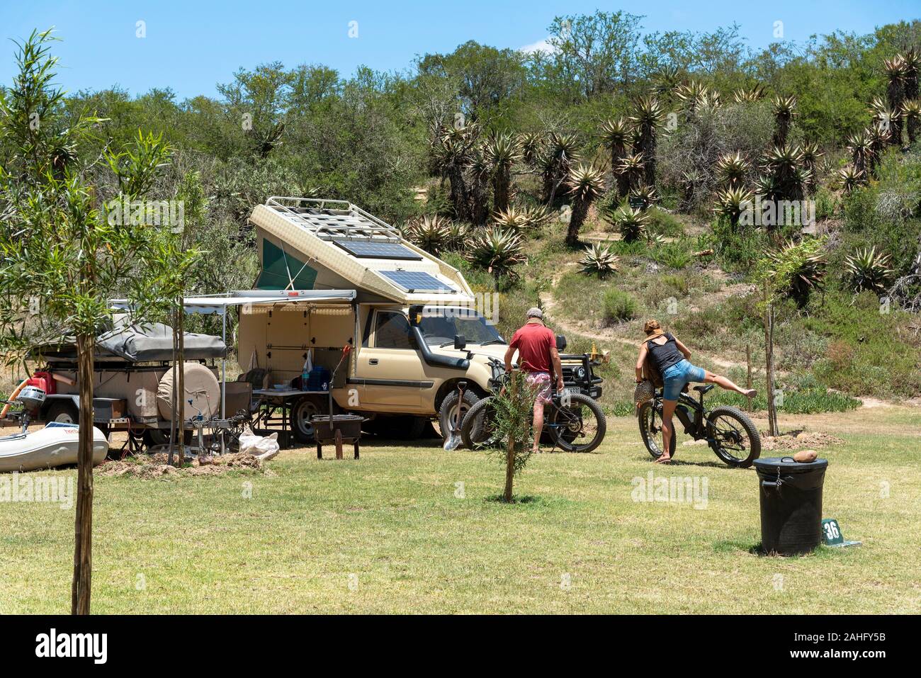 Swellendam, Western Cape, South Africa, December 2019. Couple with cycles on a campsite along the Garden Route at Swellendam, South Africa Stock Photo