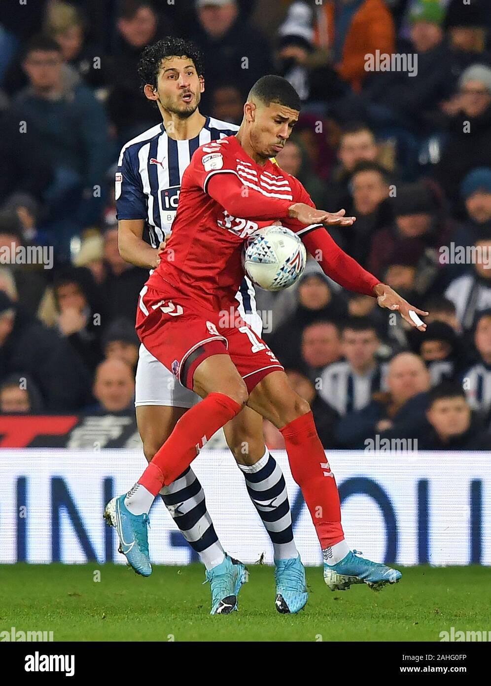 West Bromwich Albion's Ahmed Hegazy battles with Middlesbrough's Ashley Fletcher during the Sky Bet Championship match at The Hawthorns, West Bromwich. Stock Photo