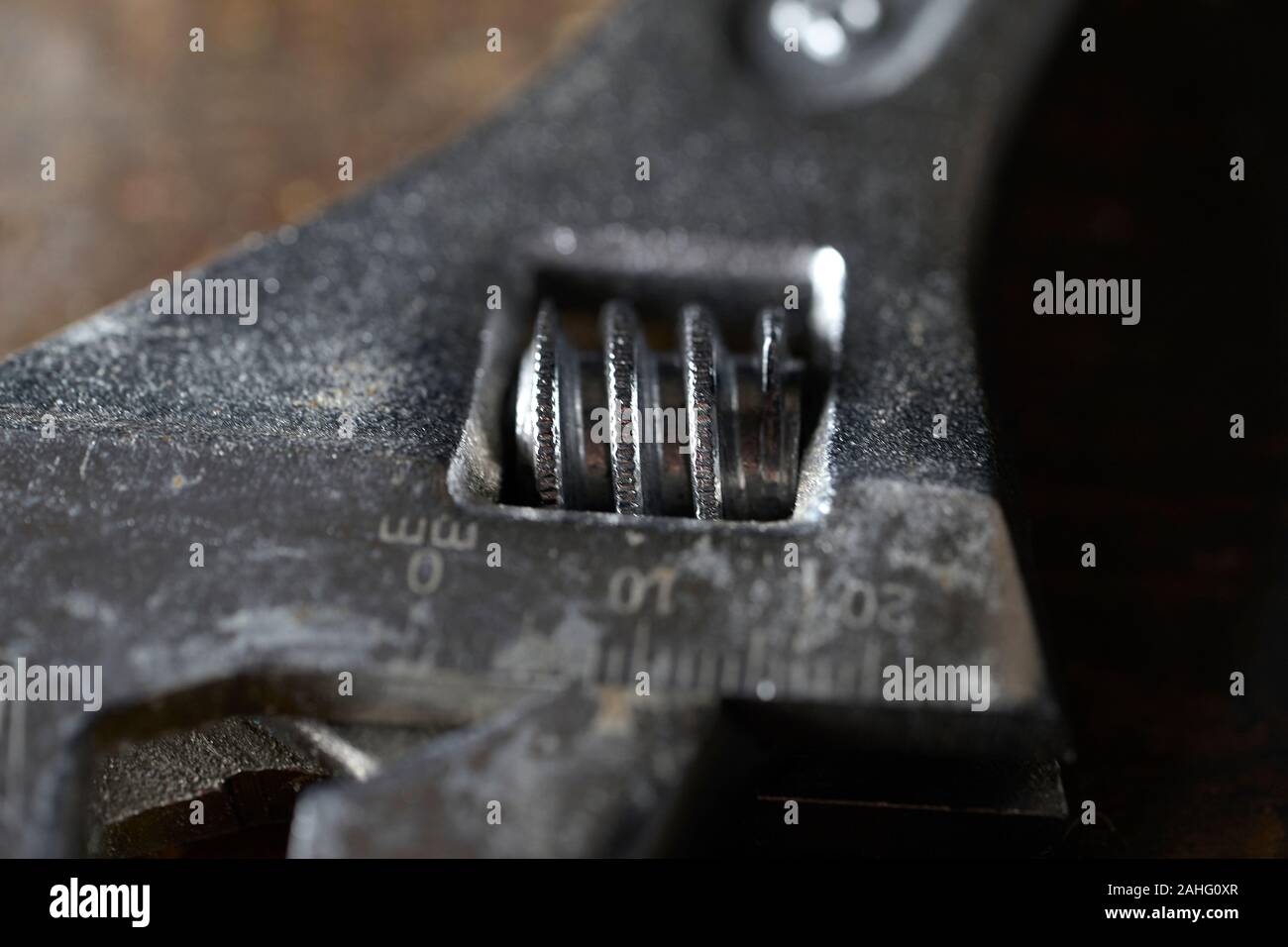 Adjustable wrench isolated on wooden background . Macro photography Stock Photo