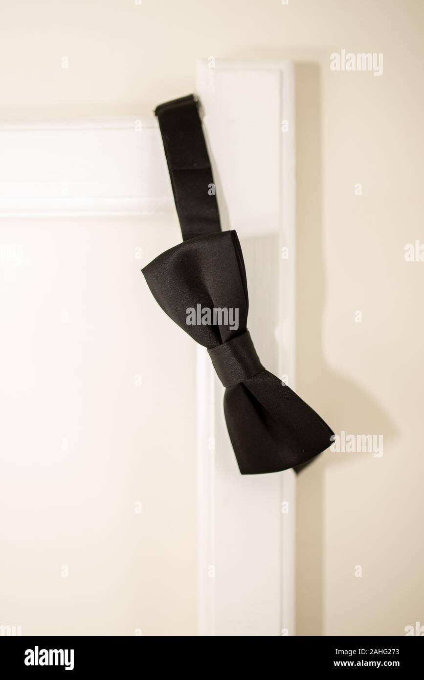 black bow tie in bed Stock Photo