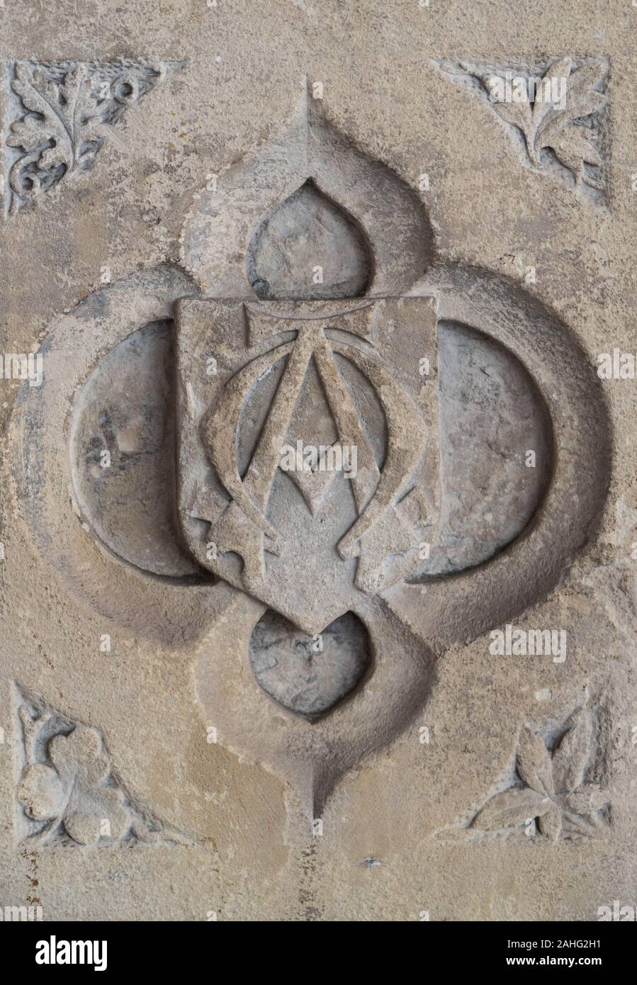 Ornate font carving of the monogram Alpha and Omega, St Catherine church Hoarwithy Herefordshire UK. February 2019 Stock Photo
