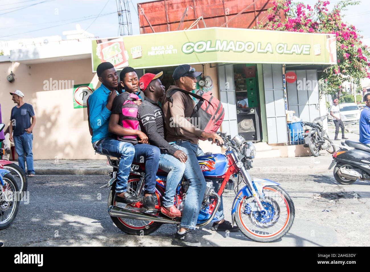 Four people on one motorcycle hi res stock photography and images