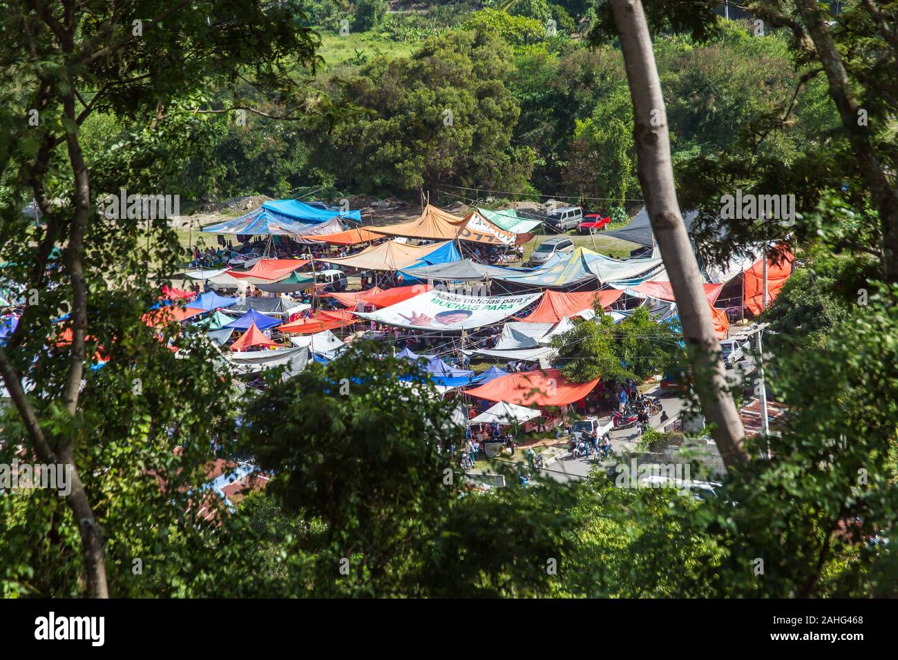 dramatic colourful image of tents and tarps in a small Haitian market in the caribbean mountains of the dominican republic. Stock Photo