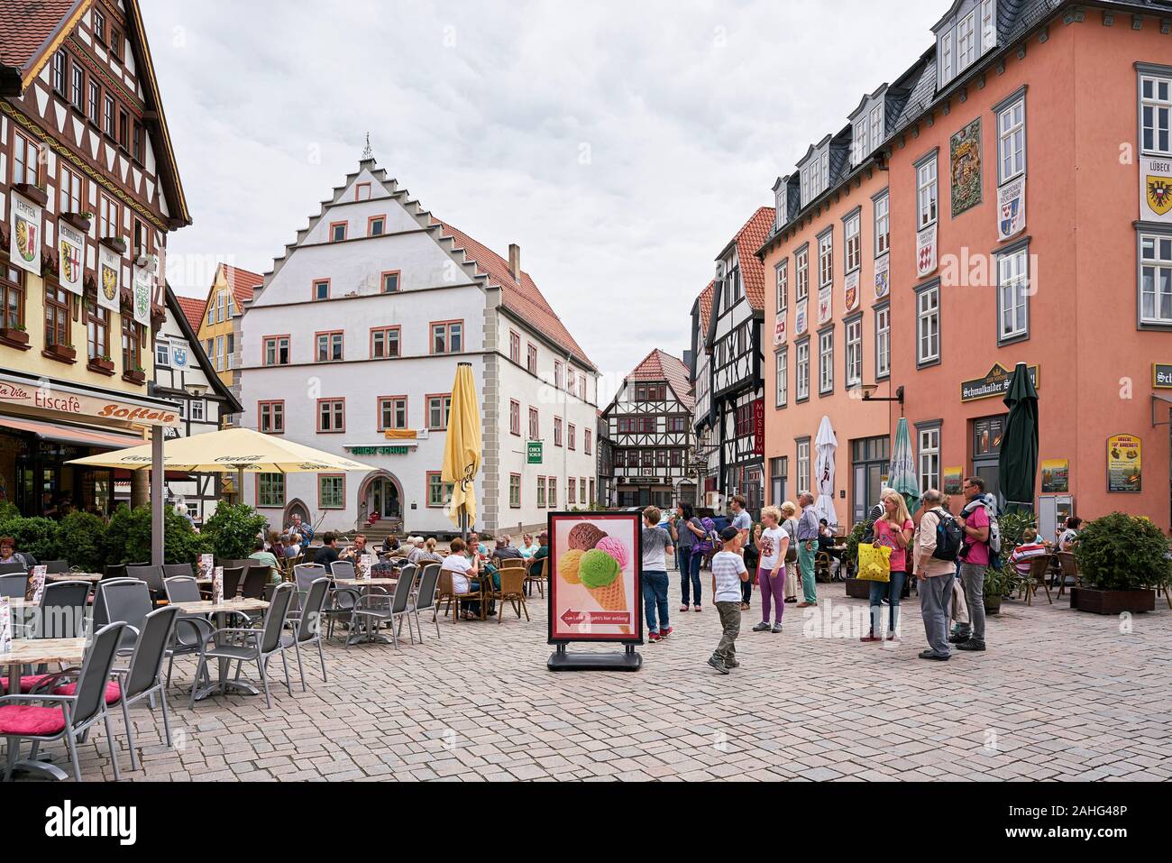 Tourists at a cafe in the historic old town of Schmalkalden in Thuringia Stock Photo